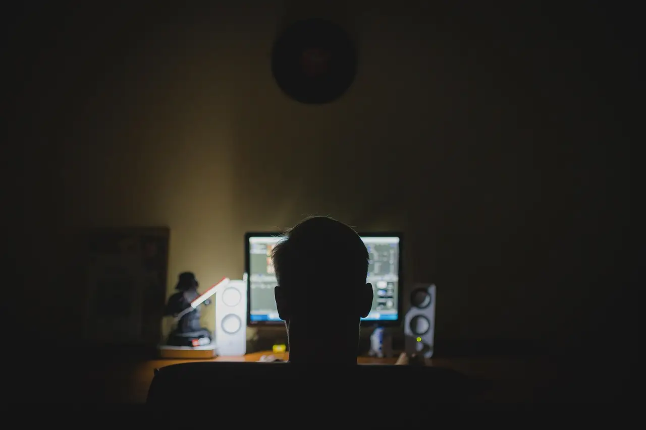 A dark computer monitor on a desk