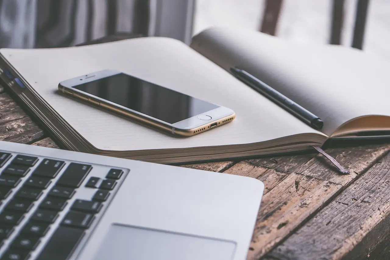 A laptop and a smartphone on an office desk