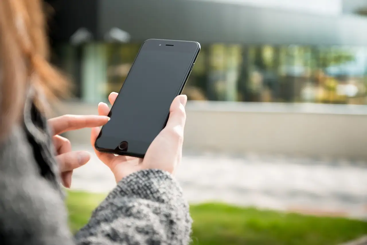 A smartphone showing an incoming call and a message notification.