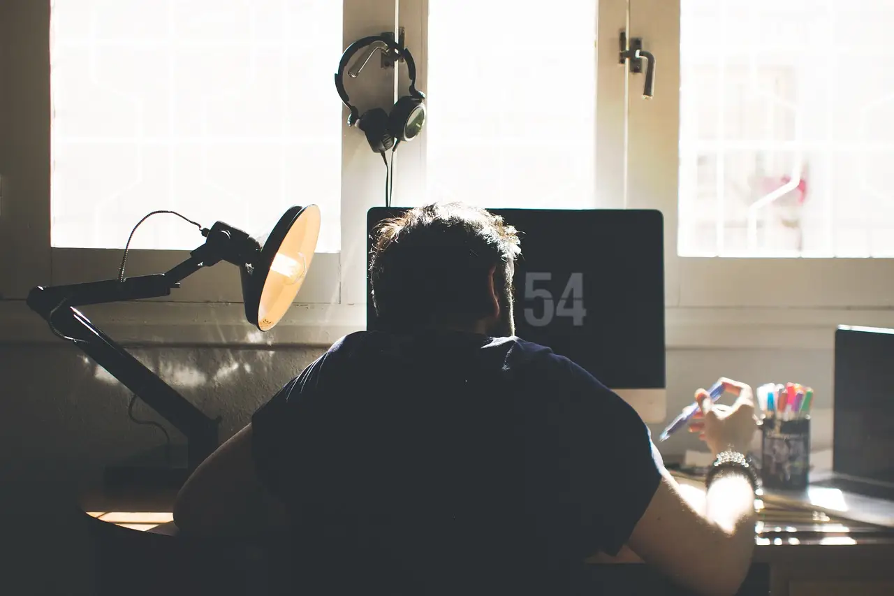 A man working at a computer desk